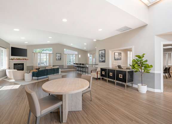 Spacious community room with vaulted ceiling and skylights at The at Elmwood Terrace Apartments, Frederick, 21702