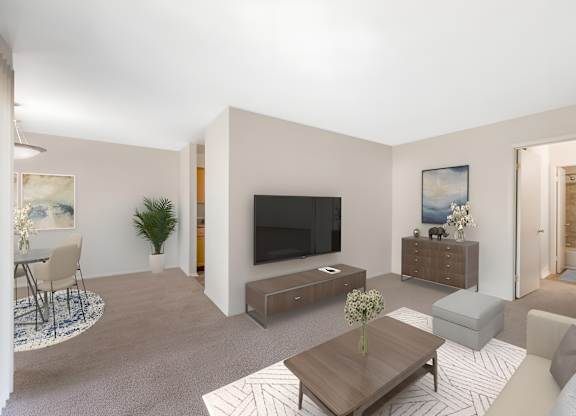 Living Room With TV at The Apartments at Hunters Glen, Frederick