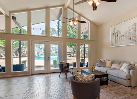 Clubhouse with grey sofa at Lakeshore Landing Apartments, Ridgeland, 39157