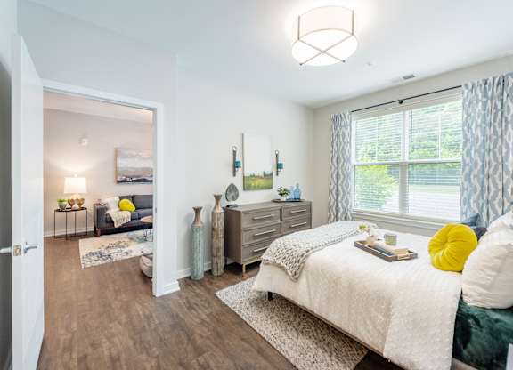 Bedroom with cozy bed at Lumen Apartments, Virginia