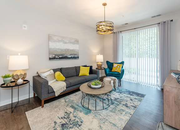 Lumen Living room with couch at Lumen Apartments, Hampton, 23666