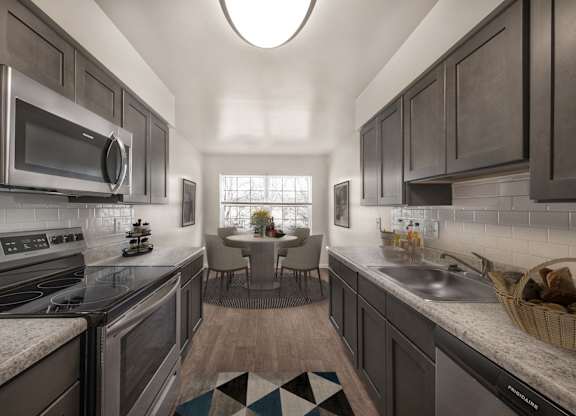 Kitchen with mosaic tiles and cabinets at The Apartments at Owings Run, Maryland, 21117