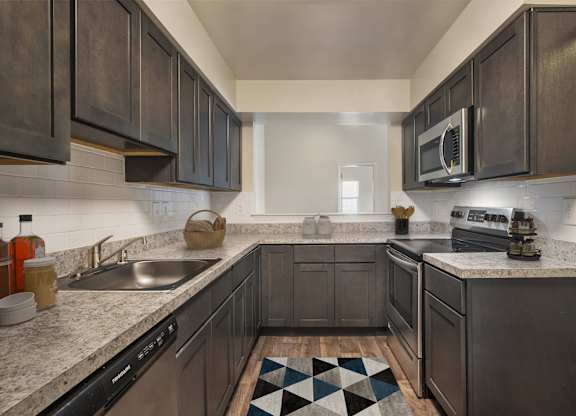 Kitchen with mosaic tiles at The Apartments at Owings Run, Maryland