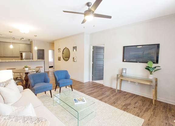 Living Room with white couch at Midtown Row Apartments, Montgomery, Alabama