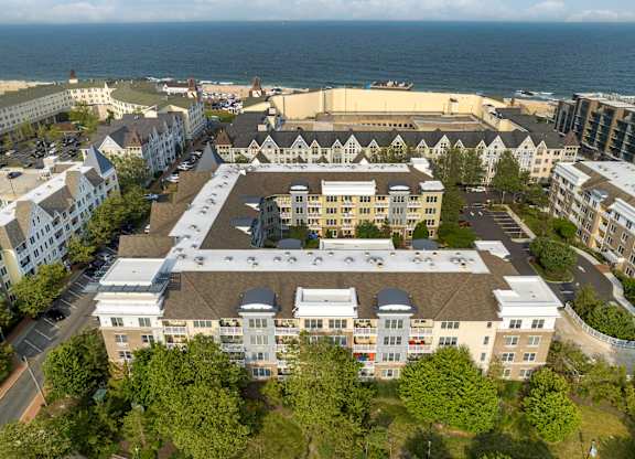 Aerial view of oceanfront residential community with courtyard at Pier Village Apartments, Long Branch, 7740