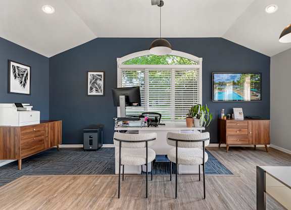 an office with blue walls and a window and a table with chairs at Quail Ridge, New Jersey, 08536
