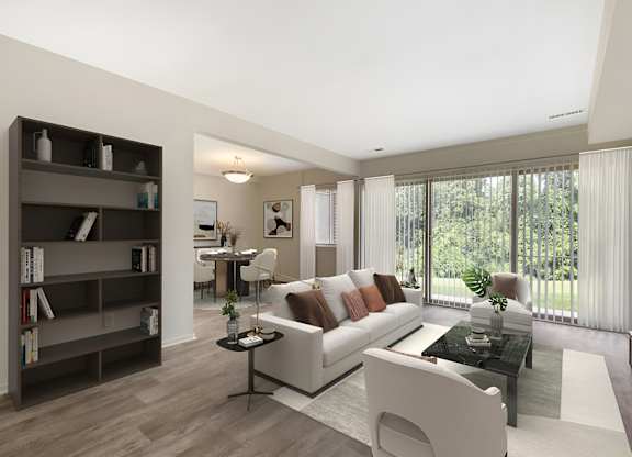 a living room filled with furniture and a large window at Copper and Quarry Village, Pikesville, MD