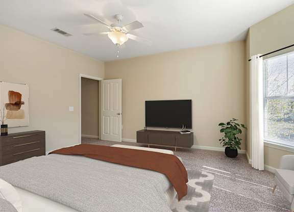 Bedroom with window at Reflections of Island Park Apartments, Shreveport
