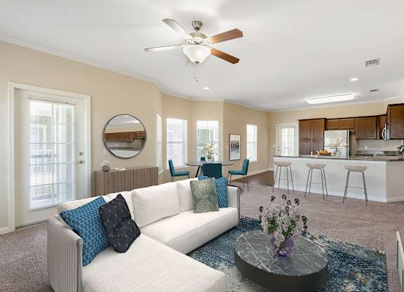 Living room with couch at Reflections of Island Park Apartments, Louisiana