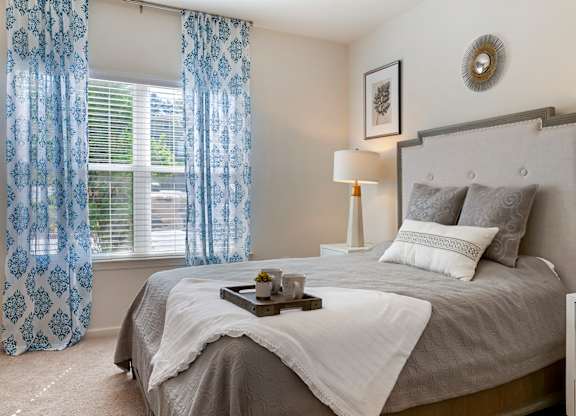 Bedroom with cozy bed at Skyland Exchange Apartments, Asheville, 28803