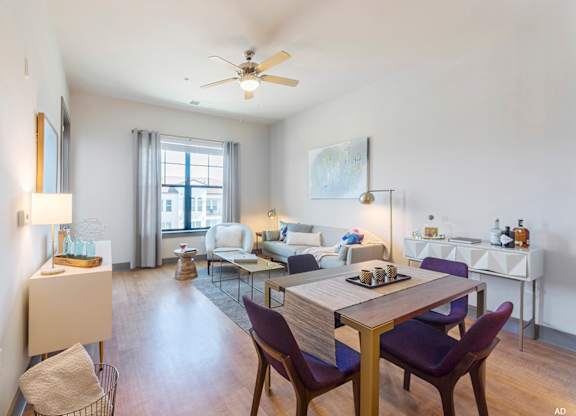 a living room with white walls and a ceiling fan at The Addison,Louisiana 70836