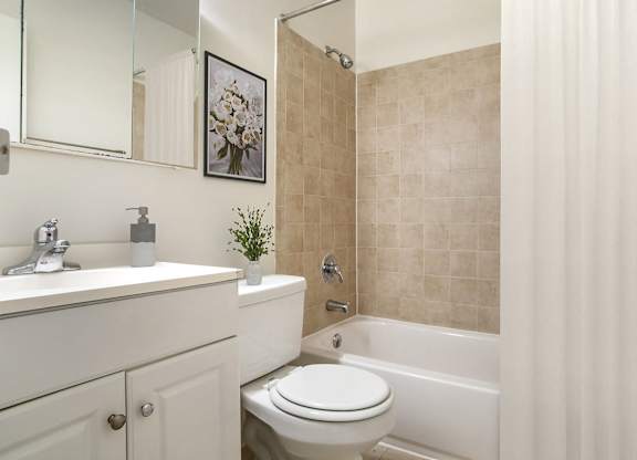 A Bathroom with Shower Curtains at The Manor/The Manor East Apartments, Virginia, 20176