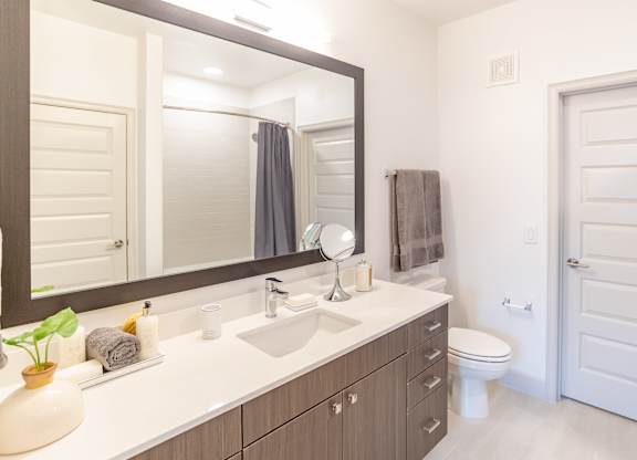 Vanity in bathroom at The Rosemary Apartments, Humble, 77346
