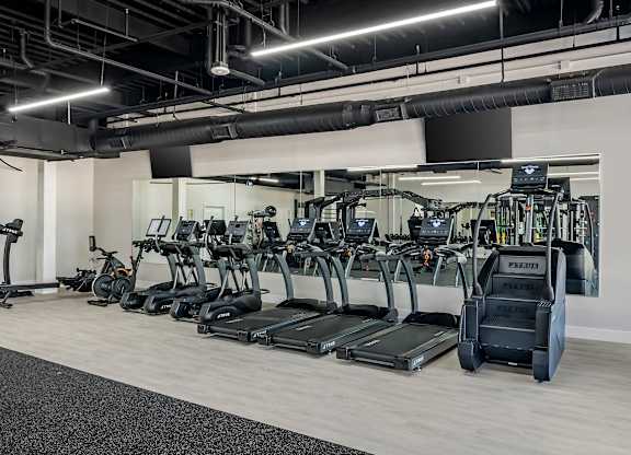 a row of cardio machines in a gym at Villaggio Apartments, Bossier City, 71111