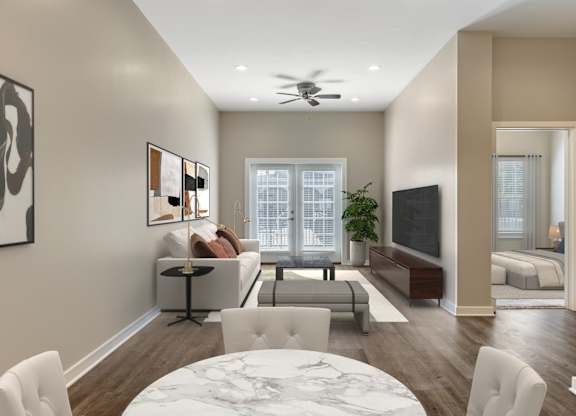 a living room with a couch and a table at Villaggio Apartments, Bossier City, Louisiana
