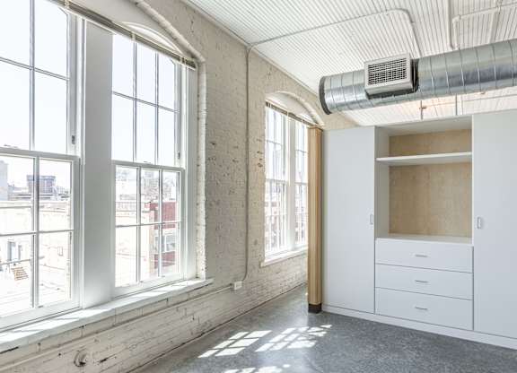 Room with white cabinets at Wheelhouse Lofts, Dayton, OH, 45402