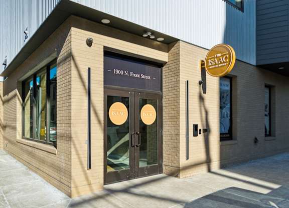 The front of a building with a sign that reads "ISAAC" and "1900 N. Fulton St."