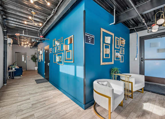 A room with blue walls and wooden flooring.