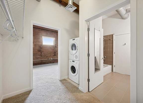 A laundry room with a washer and dryer.