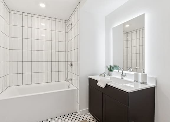 A white tiled bathroom at The Isaac Apartments, Pennsylvania