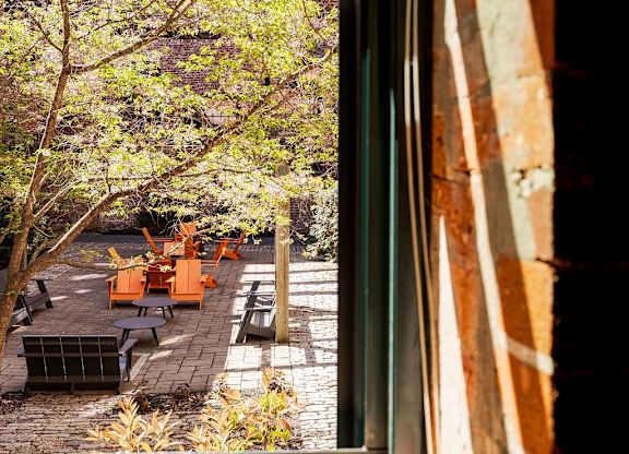 A view of a patio through a window.