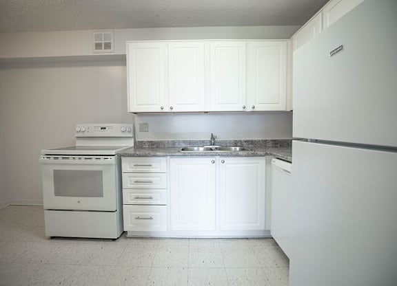 Kitchen with White Cabinets and White Appliances