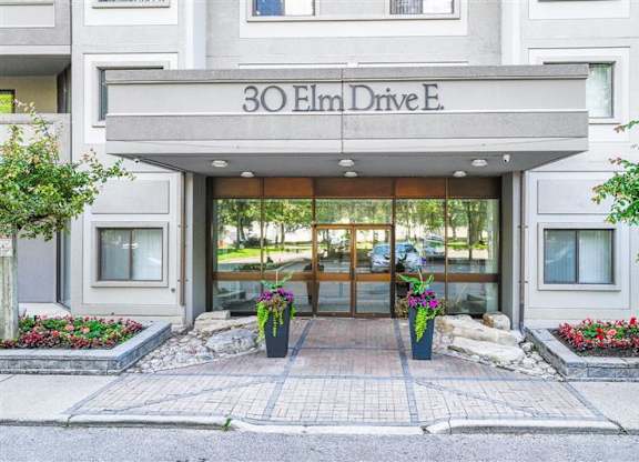 The front of a building with the name 30 Elm Drive E.