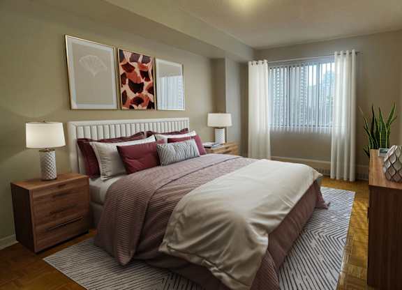 a bedroom with a bed and a window