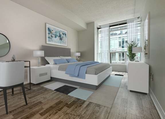 a bedroom with a bed and a large window