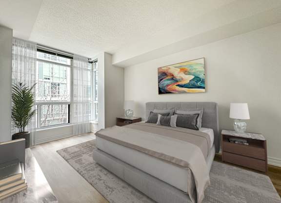 a bedroom with a large bed and a large window