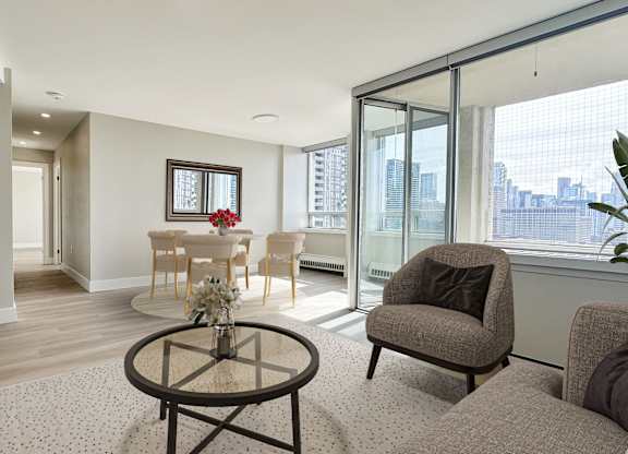 Dining and Living Space with view of balcony
