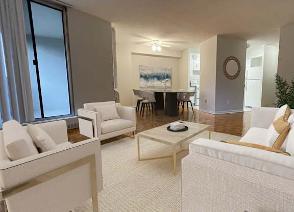 a living room with a couch and chairs and a dining room table