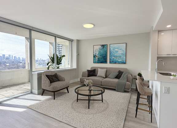 Living Space with view of balcony and open concept kitchen