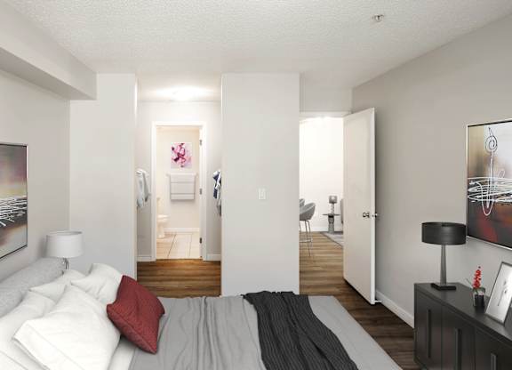 A bedroom with a bed, a nightstand, and a painting on the wall.