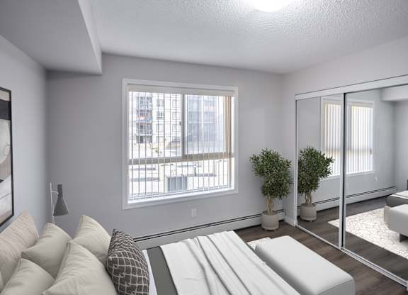 A modern living room with a large window and a couch.