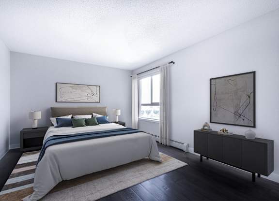 A bedroom with a large bed and a painting on the wall.