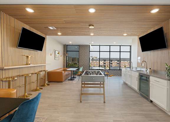 A modern kitchen with a view of the city.