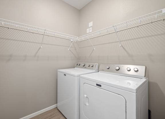A laundry room with a washer and dryer.