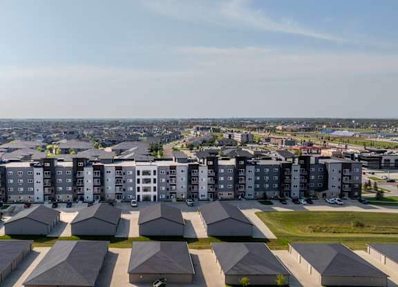 A large housing complex with multiple buildings and attached houses.