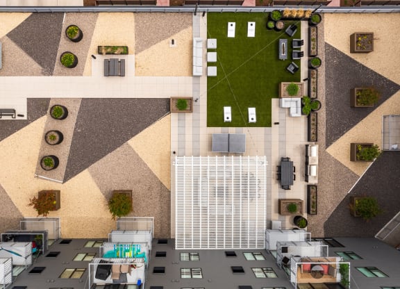 an aerial view of a building with a courtyard and grass at EagleRidge Plaza Residences, Fargo, ND