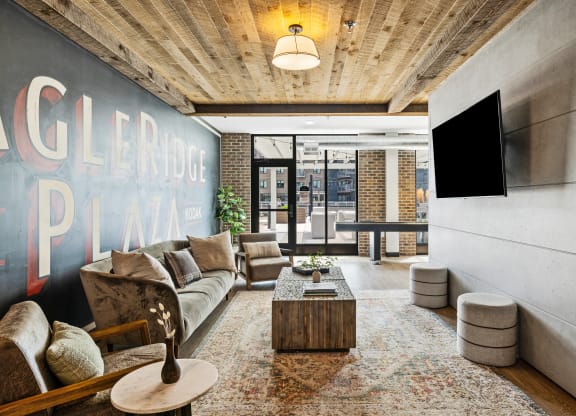 a living room with a couch and a coffee table and a tv at EagleRidge Plaza Residences, Fargo, ND