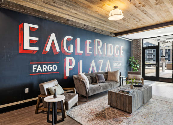 a living room with a large mural on the wall at EagleRidge Plaza Residences, Fargo, ND