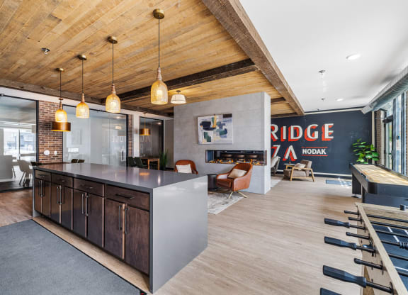 a kitchen with a large island in the middle of a room with a living room at EagleRidge Plaza Residences, North Dakota, 58104