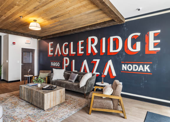 a living room with a large mural on the wall at EagleRidge Plaza Residences, Fargo, ND