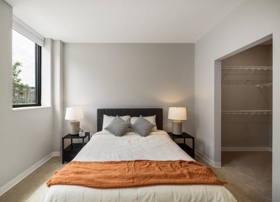 a bedroom with a large bed and a closet at EagleRidge Plaza Residences, Fargo, ND, 58104