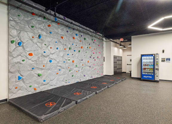 a climbing wall in a room with a vending machine at EagleRidge Plaza Residences, North Dakota