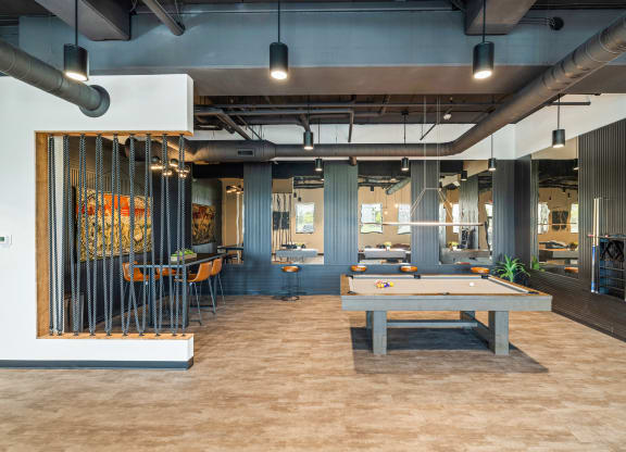 a game room with a pool table and tables at EagleRidge Plaza Residences, North Dakota, 58104