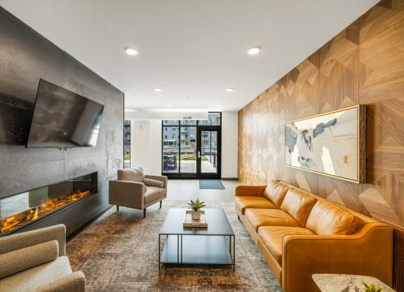 a living room with couches and a coffee table and a fireplace at EagleRidge Plaza Residences, North Dakota, 58104