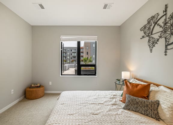 a bedroom with a large window and a bed at EagleRidge Plaza Residences, North Dakota, 58104