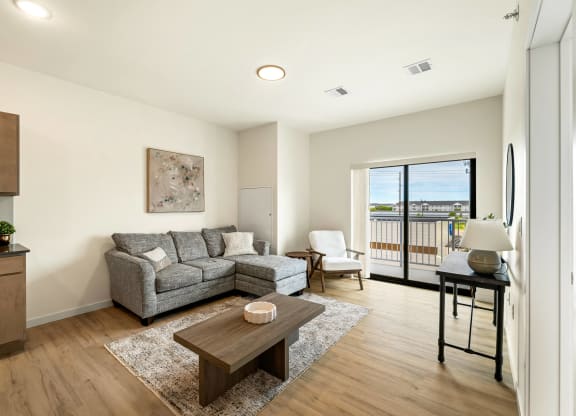 a living room with a couch and a coffee table at The Standard on 32nd, North Dakota